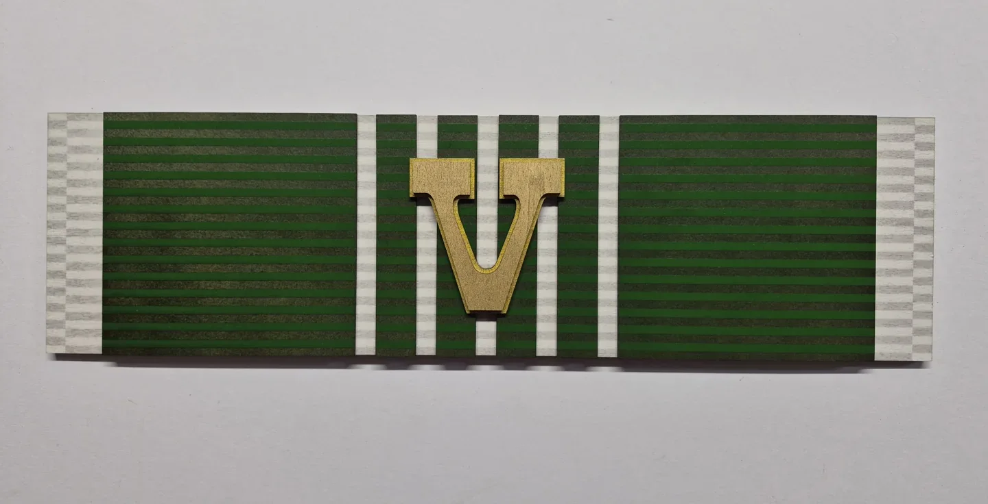 Green military service ribbon display with light stripes and a raised numeral.