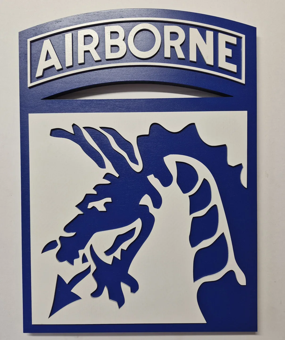 Blue and white Airborne dragon shield with a matching rectangular tab.