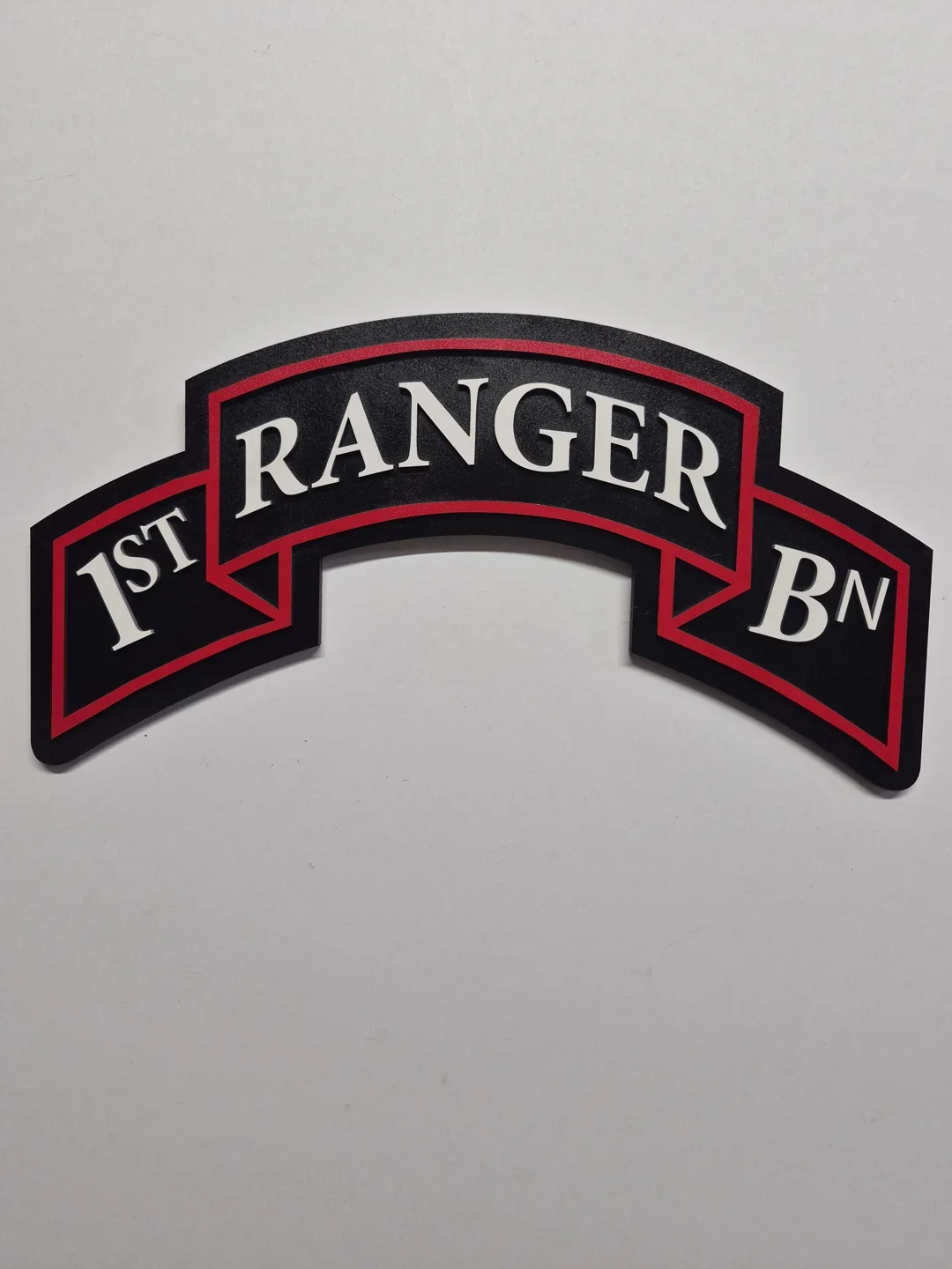 Black and red Ranger battalion scroll with layered white lettering.