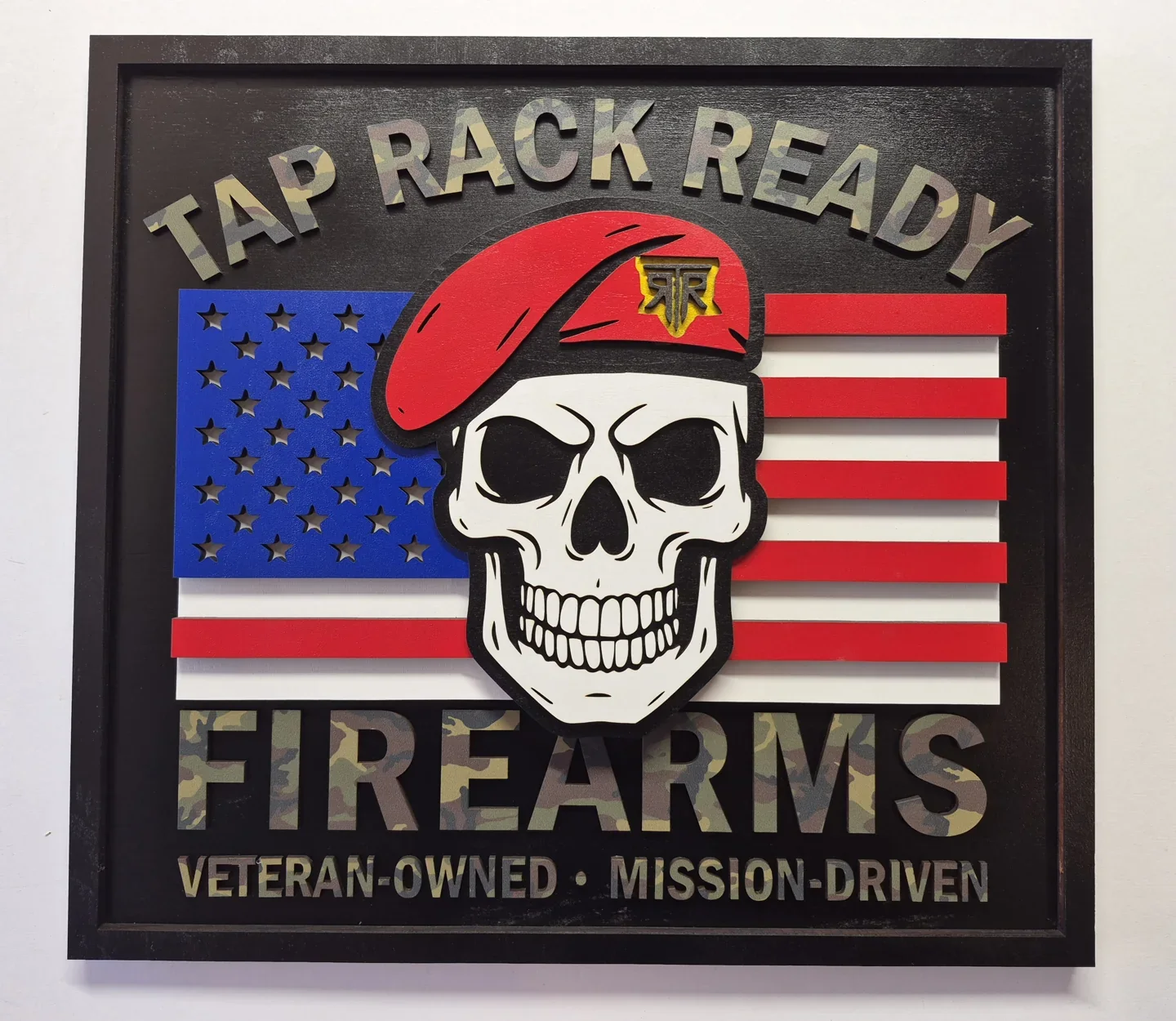 Tap Rack Ready Firearms business sign with a flag background and a beret wearing skull.